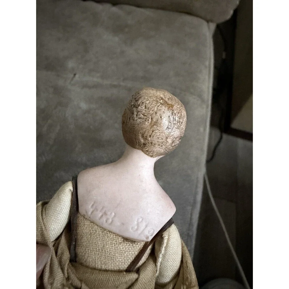 Antique German bisque gentleman doll, approximately 7 inches tall,